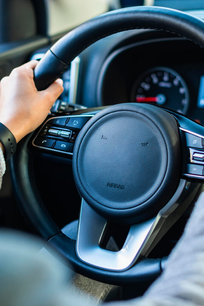 Holding steering wheel with both hands