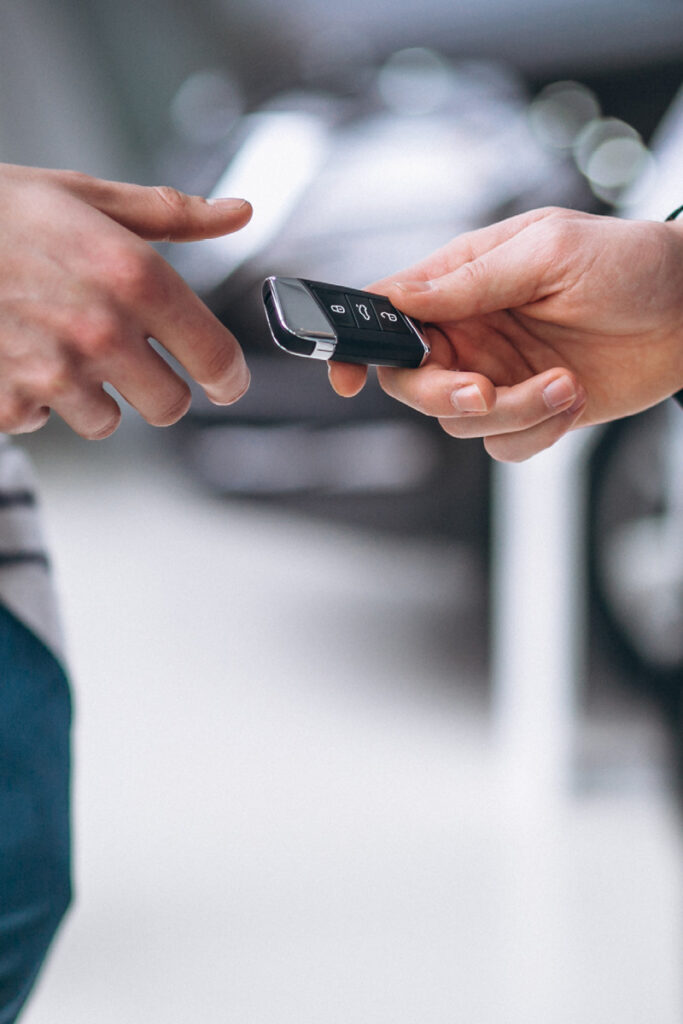 Handing car keys over to new owner