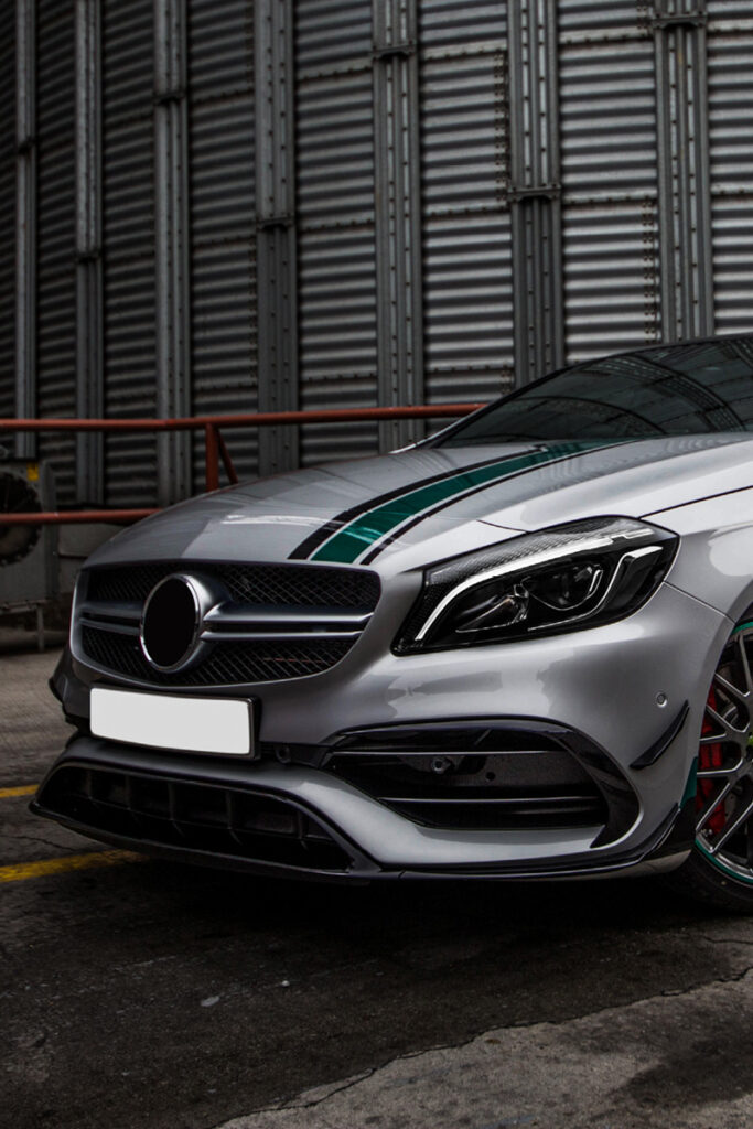 Mercedes with factory backdrop