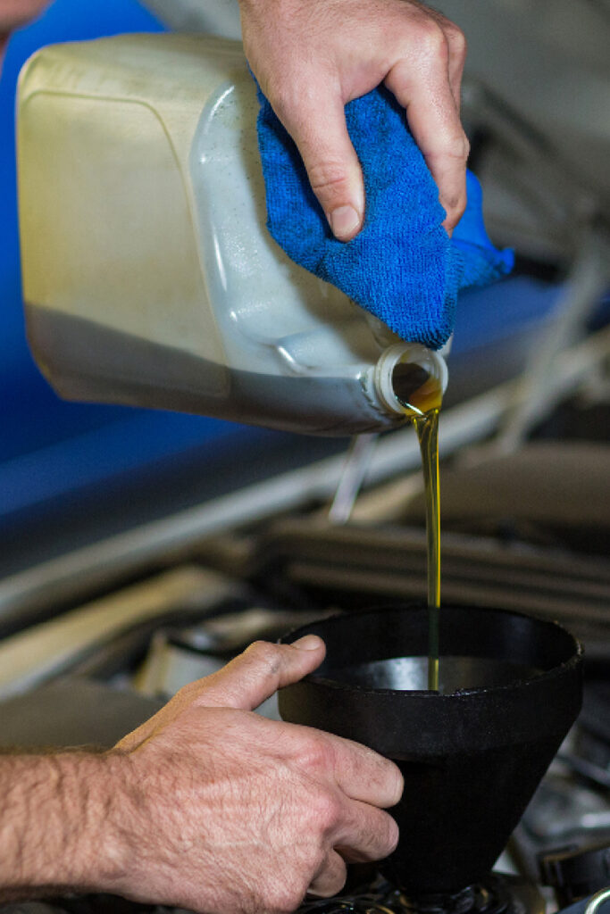 Filling up engine oil using funnel