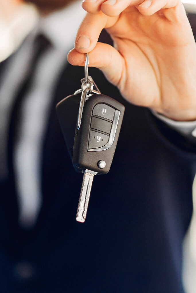 Sales person handing over keys