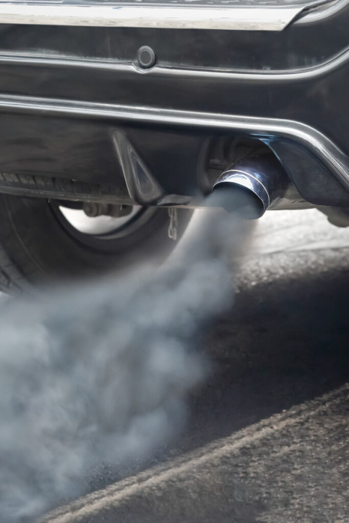 Diesel car emitting black smoke from exhaust