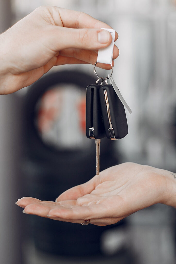 Handing over car keys to new owner