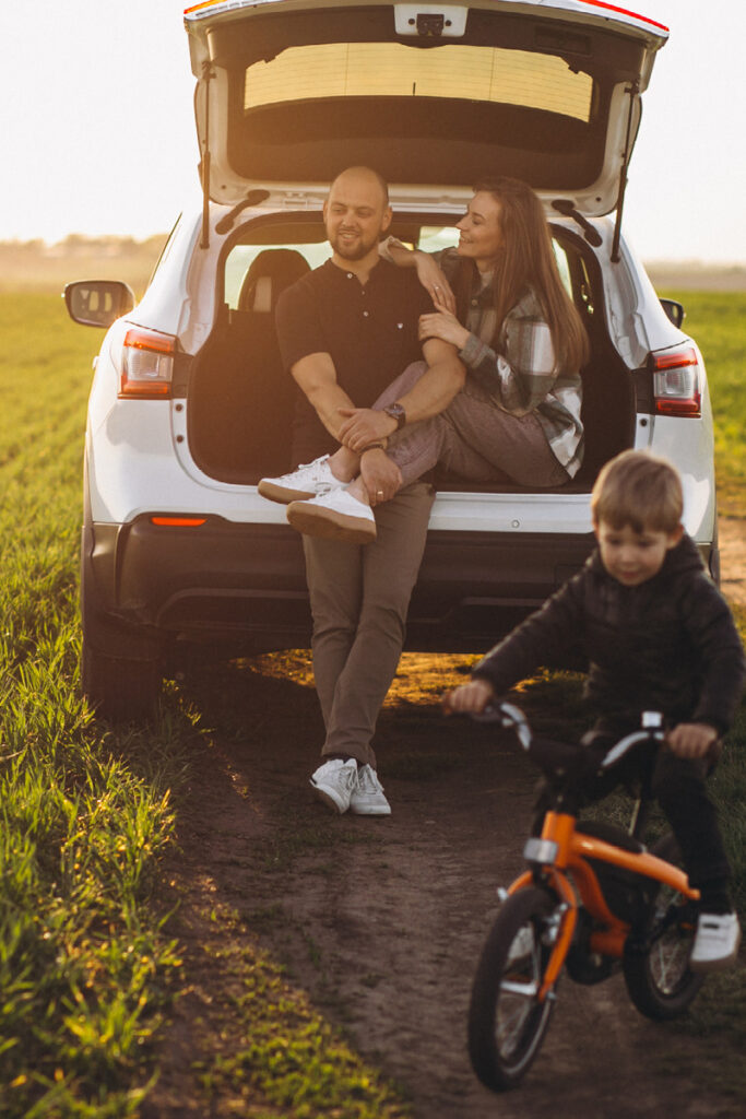 Family parked up in a field