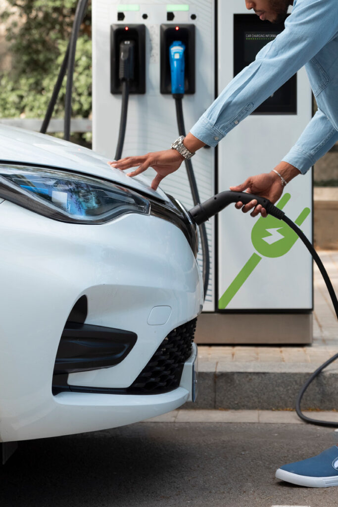 Plugging in a ev car to charging point