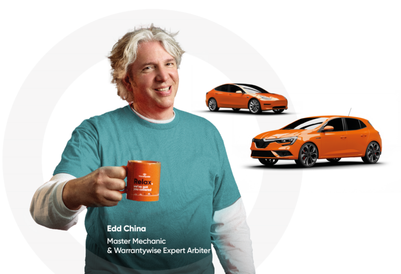 Ed-Home-Carousel-Words-Cars-Wide | Warrantywise Edd china holding a mug with two orange cars in the background