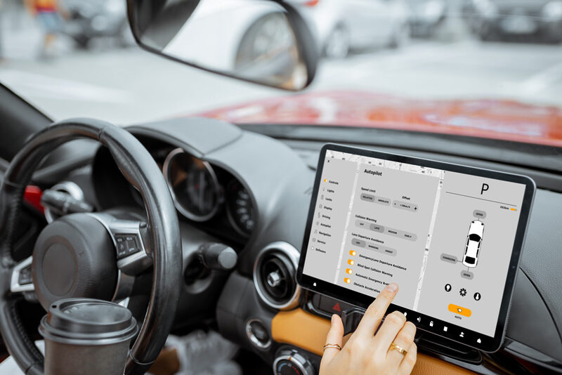 Woman controlling car with a digital dashboard | Warrantywise