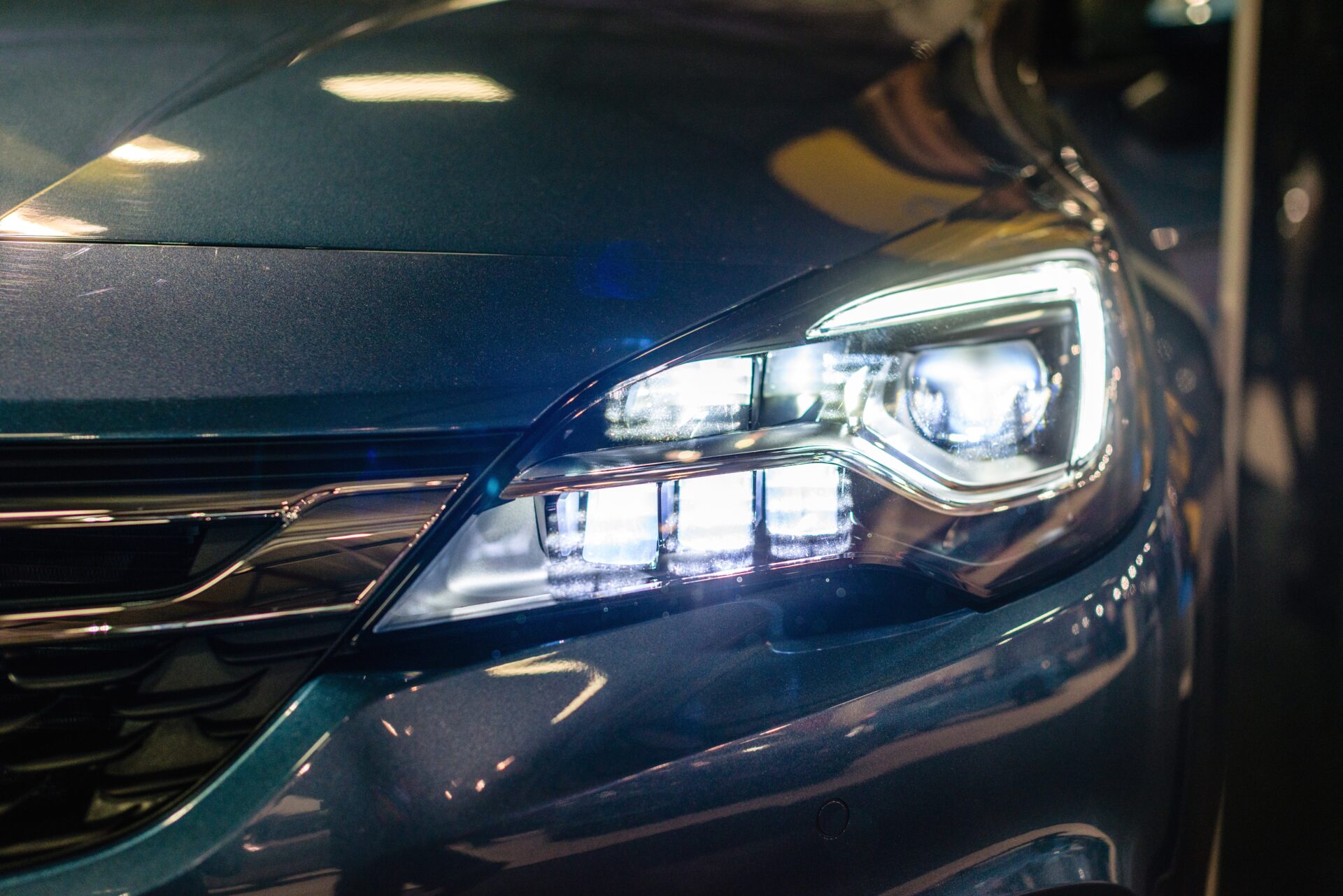 Car headlight with backlight Exterior detailWhite color car - image | Warrantywise