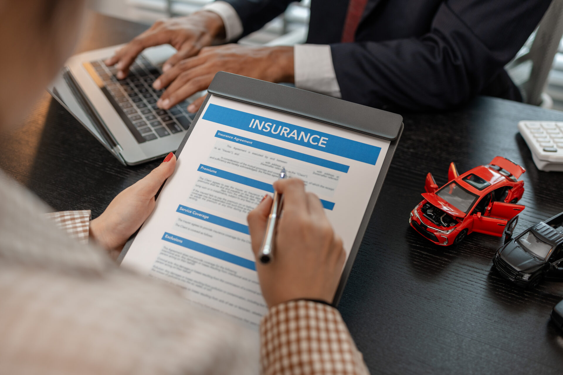 a lawyer explains the details of a car insurance policy and all the costs to a client a lawyer explains to a client what will happen if she dose not have car insurance | Warrantywise