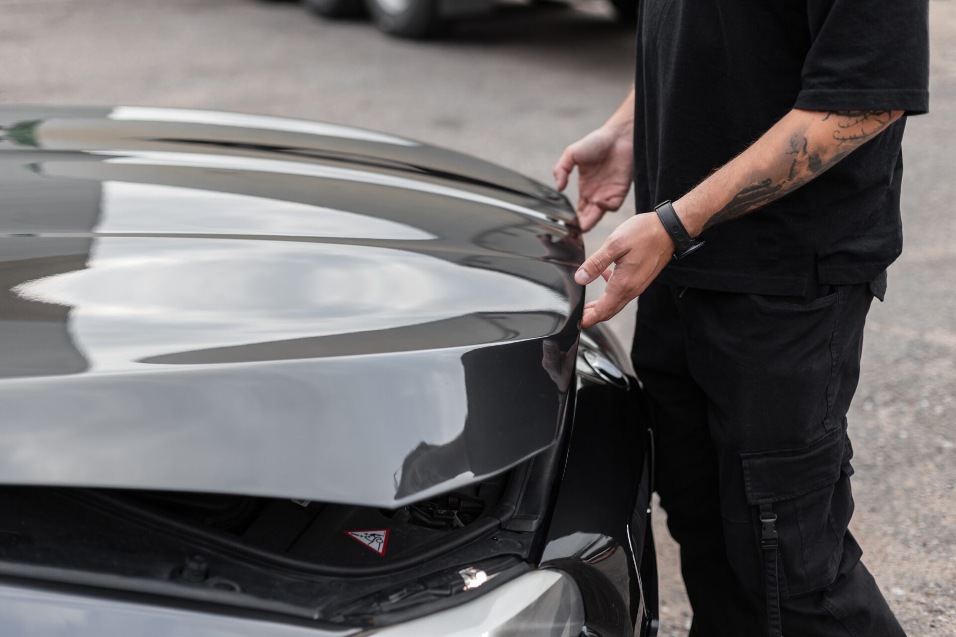 Man opens the hood of the car and looks for faults The professi | Warrantywise