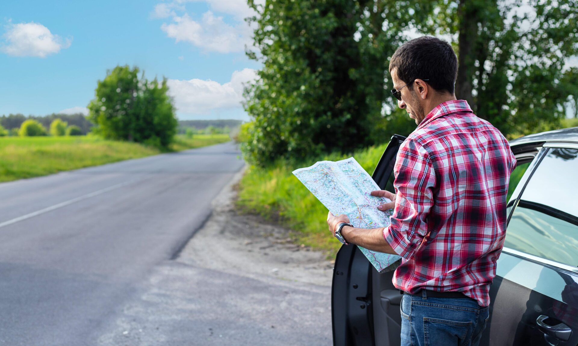 man stopped to look at roadmap