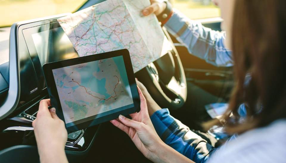 photo1 1 | Warrantywise couple comparing tablet to roadmap