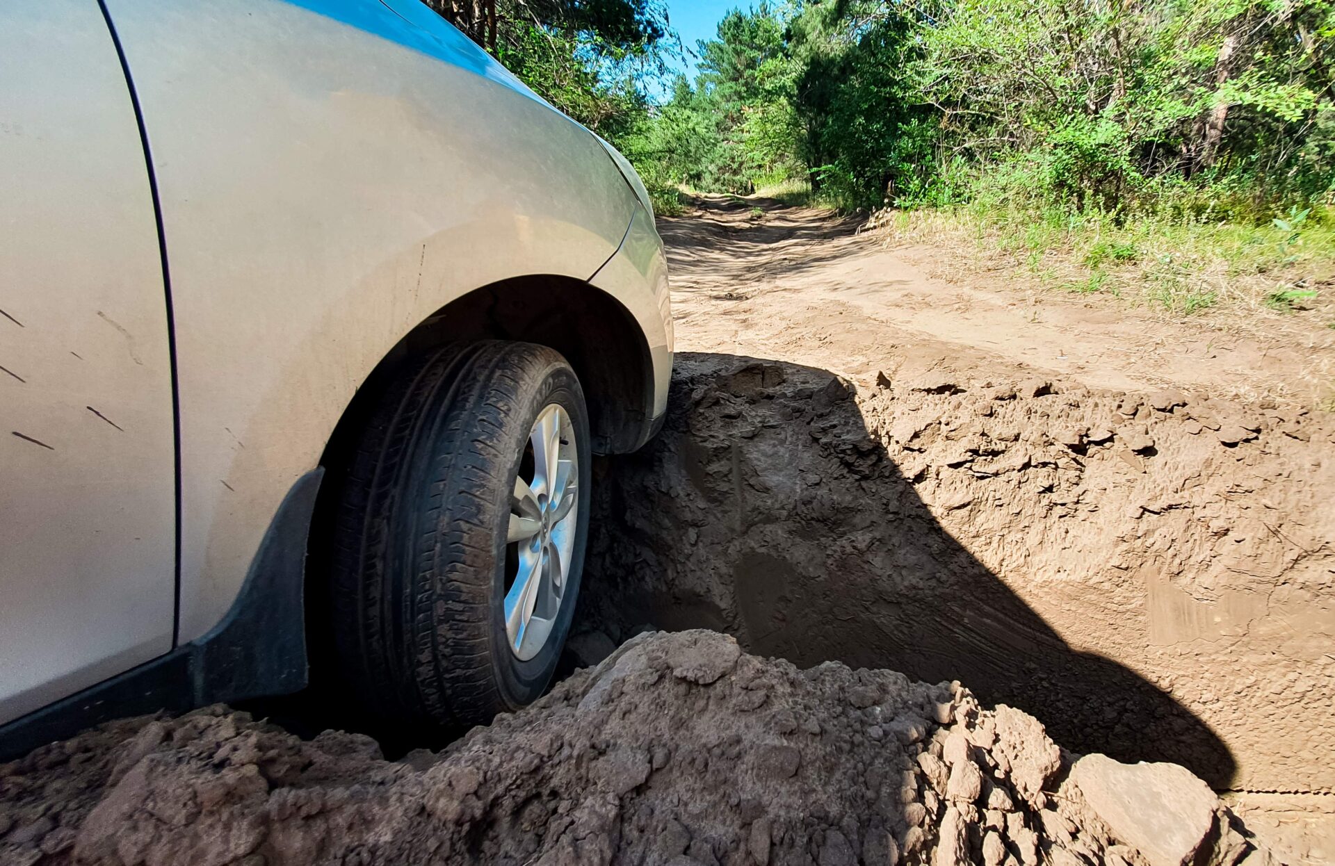 the-car-hit-the-front-wheel-in-a-deep-hole-on-the-2026-01-06-09-12-00-utc 1 | Warrantywise car stuck in ditch