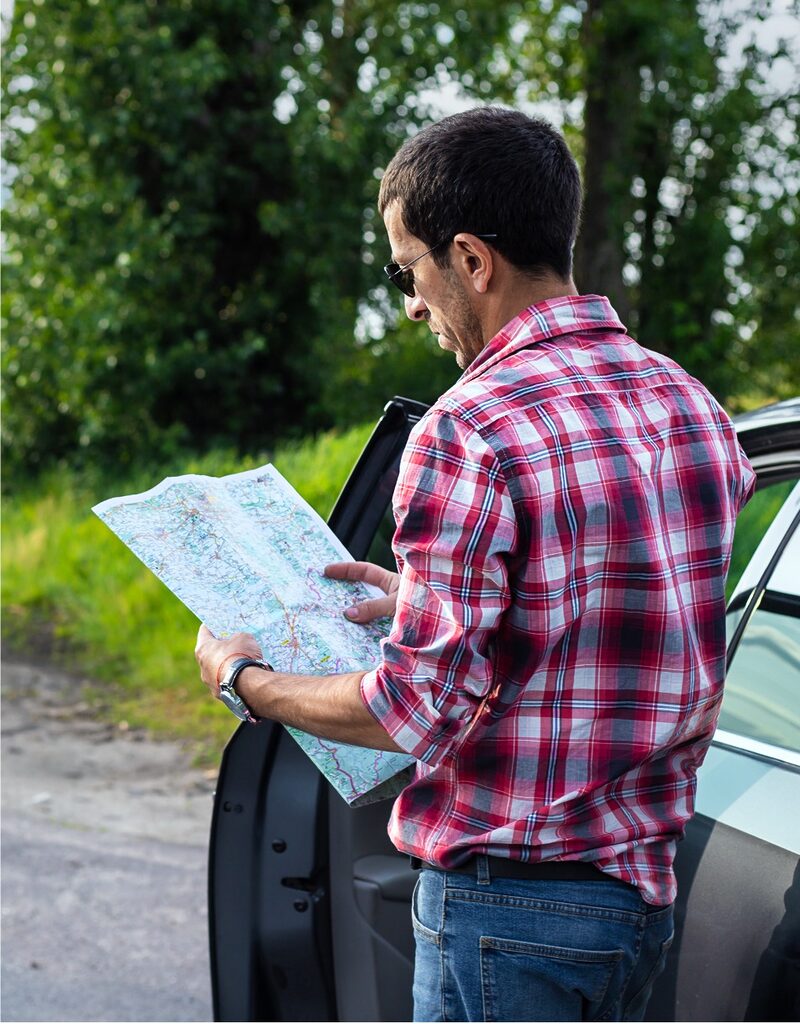 man looking at map